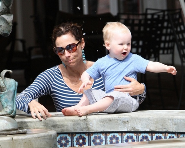 Minnie Driver, blue and white striped top, turquoise dangle earrings, sunglasses,